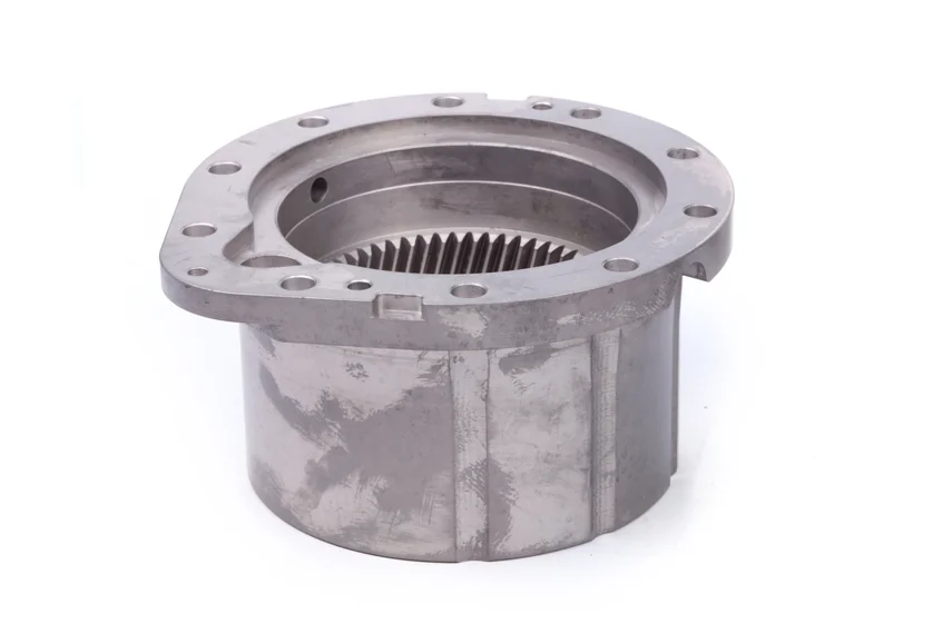 Inverted view of a flanged cylindrical component with internal helical teeth