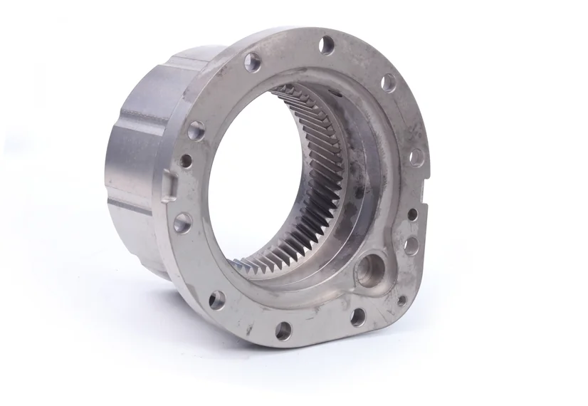Ring-shaped component with a flange and angled internal teeth