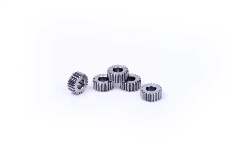 A group of five small spur gears