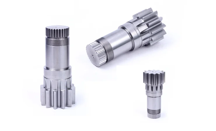 Three metal shafts with splined sections